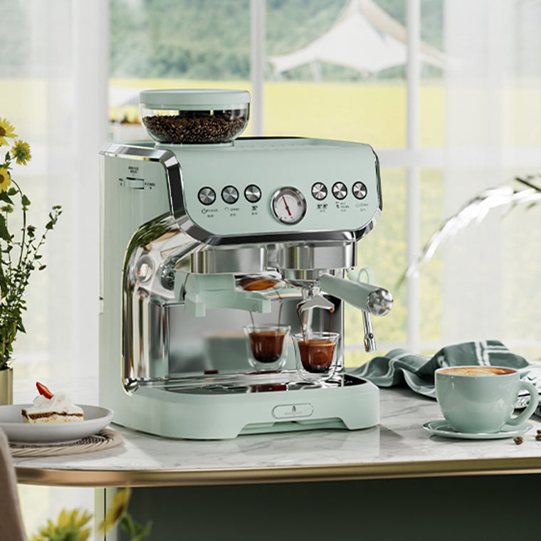 Mint green espresso machine on a kitchen counter with coffee cups and a window in the background.