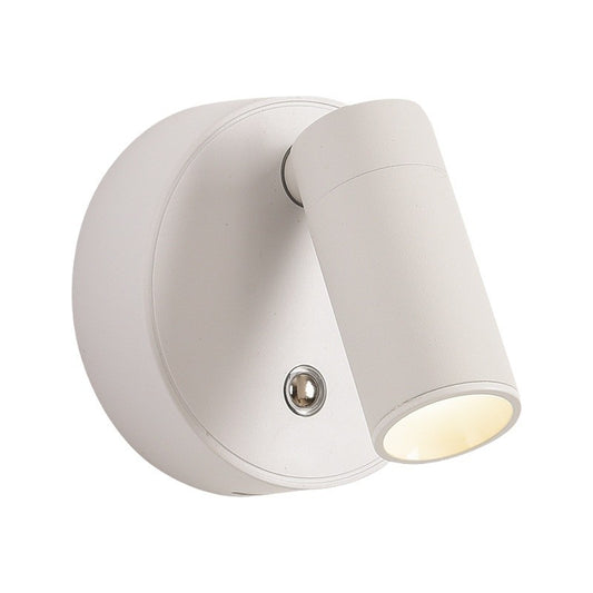 White rechargeable magnetic touch wall lamp mounted beside a bed
