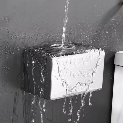 Square covered toilet paper holder in a bathroom setting


