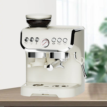 White espresso machine on a wooden surface with a blurred green plant in the background