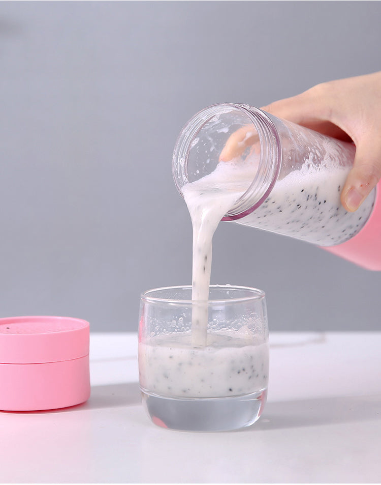 Person pouring a white powdery substance from a pink container into a glass on a gray background