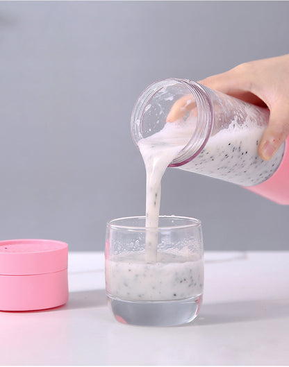 Person pouring a white powdery substance from a pink container into a glass on a gray background