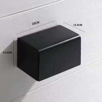 Black rectangular wall-mounted object with measurements on a light gray background