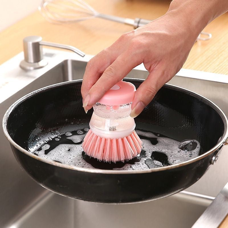 Refillable soap compartment of the dish brush open.
